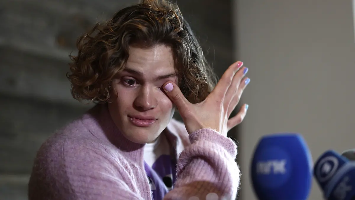 Norway's Lucas Braathen wipes his tears during a press conference in Soelden, Austria, Friday, Oct. 27, 2023. (AP Photo/Gabriele Facciotti)