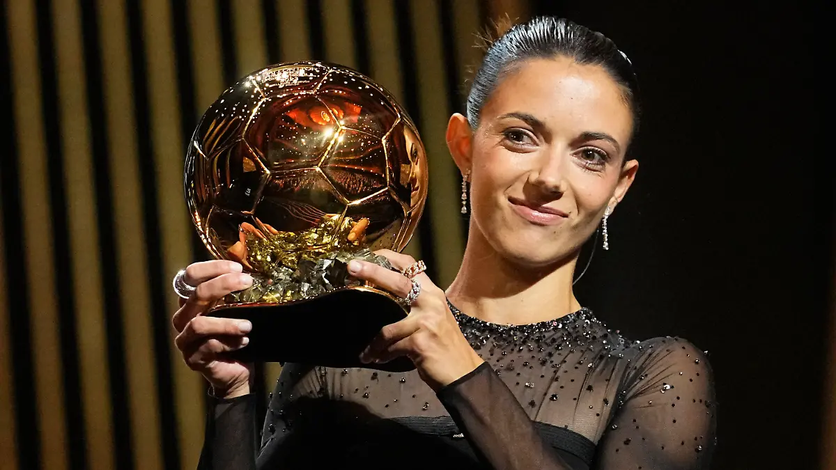 FC Barcelona's and Spain's national team's midfielder Aitana Bonmati holds the trophy as she receives the 2023 Women's Ballon d'Or award during the 67th Ballon d'Or (Golden Ball) award ceremony at Theatre du Chatelet in Paris, France, Monday, Oct. 30, 2023. (AP Photo/Michel Euler)