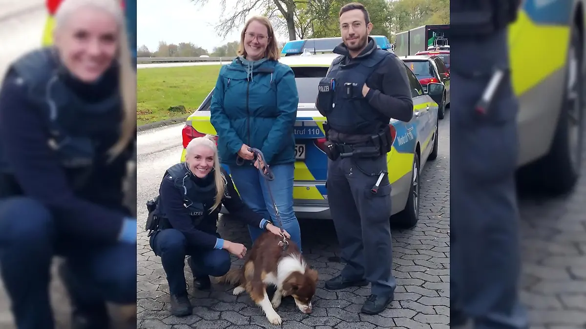 Hündin Telly, Polizisten und ihre Besitzerin posieren für ein Foto.