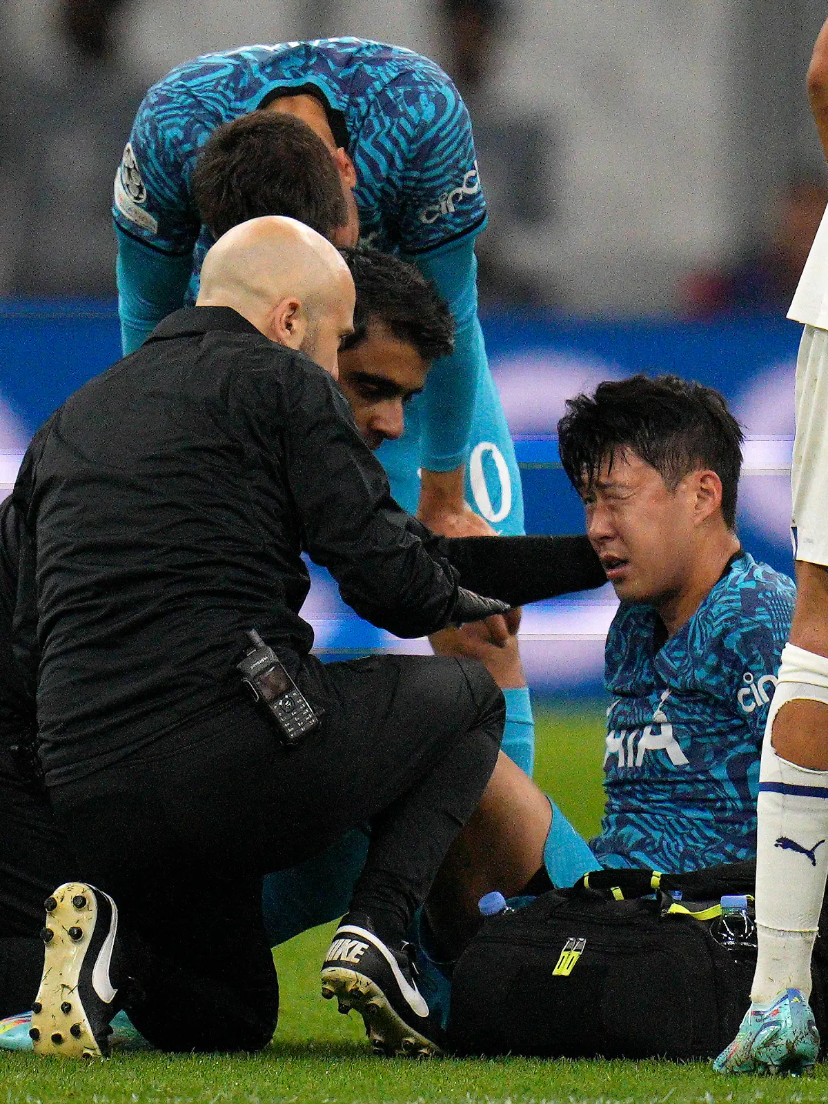 FILE - Tottenham' s Son Heung-min receives treatment after taking a knock during the Champions League Group D soccer match between Marseille and Tottenham Hotspur at the Stade Velodrome in Marseille, France, Tuesday, Nov. 1, 2022. South Korea captain Son Heung-min will undergo surgery on a facial injury, jeopardizing his availability for the World Cup in Qatar. (AP Photo/Daniel Cole, File)