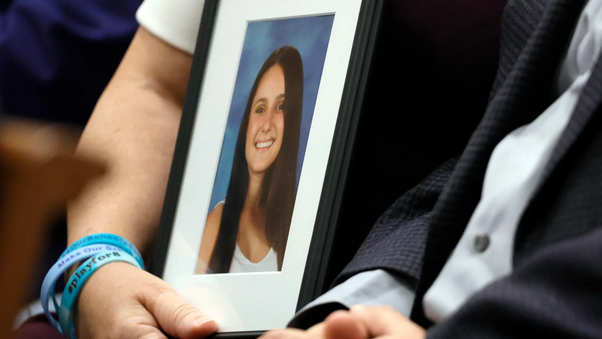 Lori Alhadeff holds a picture of her daughter during the sentencing hearing for Parkland shooter Nikolas Cruz at the Broward County Courthouse in Fort Lauderdale, Fla., on Wednesday, Nov. 2, 2022. Alhadeff's daughter, Alyssa, was killed in the 2018 shootings. Cruz was formally sentenced to life in prison for murdering 17 people at Parkland's Marjory Stoneman Douglas High School more than four years ago. (Amy Beth Bennett/South Florida Sun Sentinel via AP, Pool)