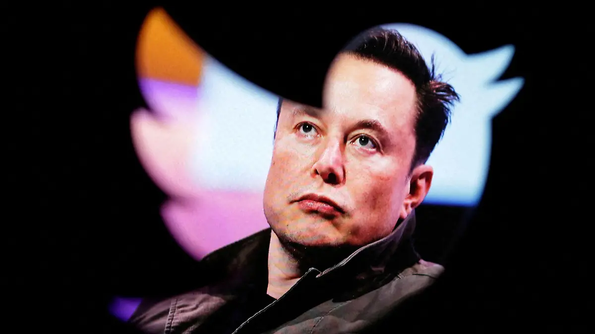 FILE PHOTO: FILE PHOTO: Elon Musk's photo is seen through a Twitter logo in this illustration taken October 28, 2022. REUTERS/Dado Ruvic/Illustration/File Photo/File Photo