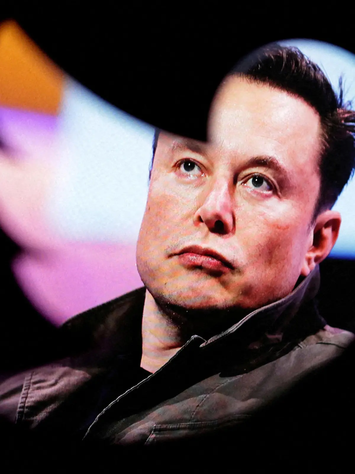 FILE PHOTO: FILE PHOTO: Elon Musk's photo is seen through a Twitter logo in this illustration taken October 28, 2022. REUTERS/Dado Ruvic/Illustration/File Photo/File Photo