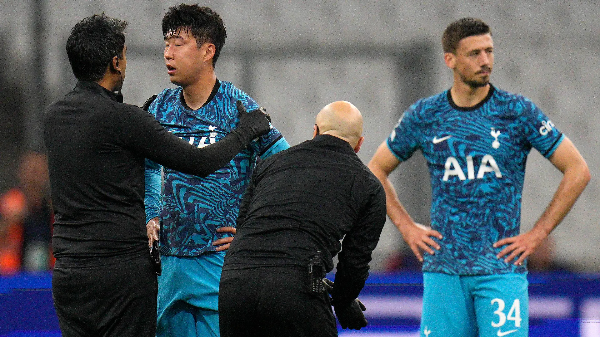 FILE - Tottenham's Son Heung-min receives treatment after taking a knock during the Champions League Group D soccer match between Marseille and Tottenham Hotspur at the Stade Velodrome in Marseille, France, Tuesday, Nov. 1, 2022. South Korea captain Son Heung-min will undergo surgery on a facial injury, jeopardizing his availability for the World Cup in Qatar. (AP Photo/Daniel Cole, File)