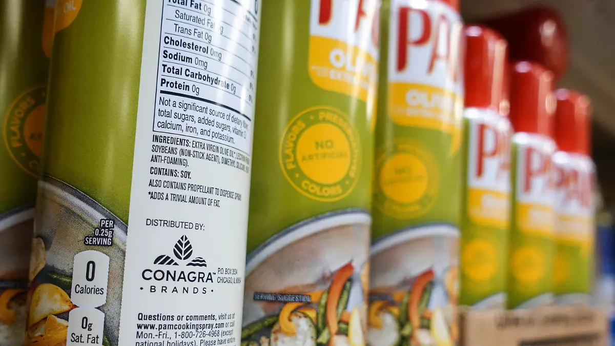 FILE - Cooking spray oils by Pam, a Conagra brand, rest on a supermarket shelf, June 25, 2019, in Cincinnati. On Monday, Oct. 30, 2023, a jury in Illinois ordered Chicago-based Conagra Brands to pay $7.1 million to a Pennsylvania woman who was badly injured in 2017 when a can of commercial brand cooking spray ignited in a kitchen at her workplace and set her aflame. The verdict is the first of numerous other cases from burn victims across the country with similar stories citing accidents that occurred with Conagra-made cooking spray brands, including its popular grocery store brand Pam. (AP Photo/John Minchillo, File)