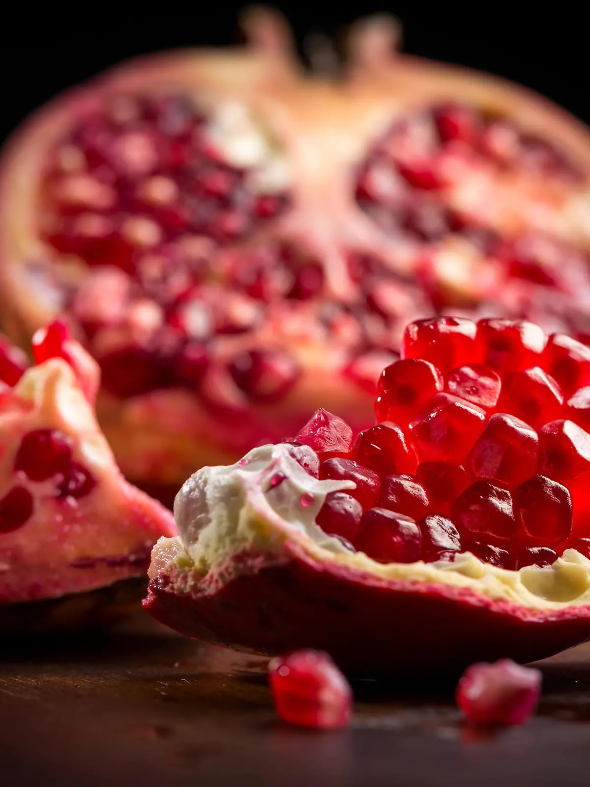 Fresh ripe pomegranate on cutting board