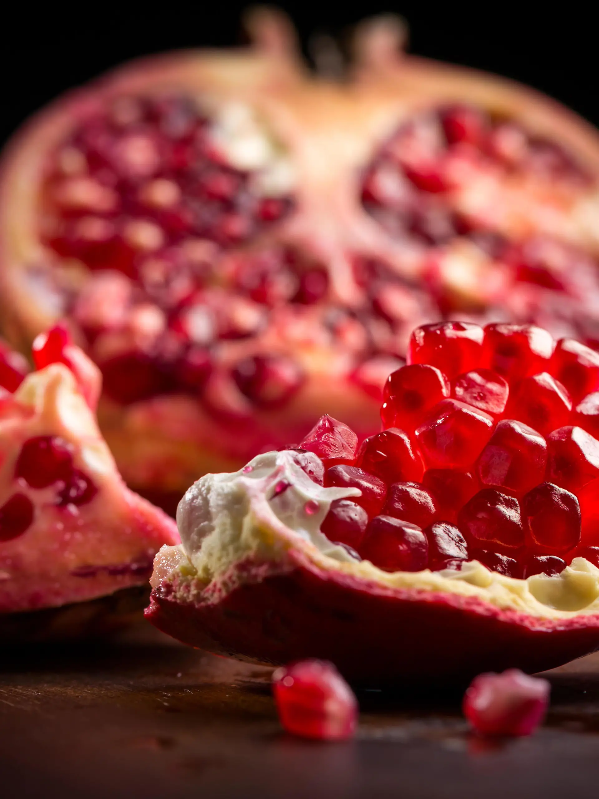Fresh ripe pomegranate on cutting board