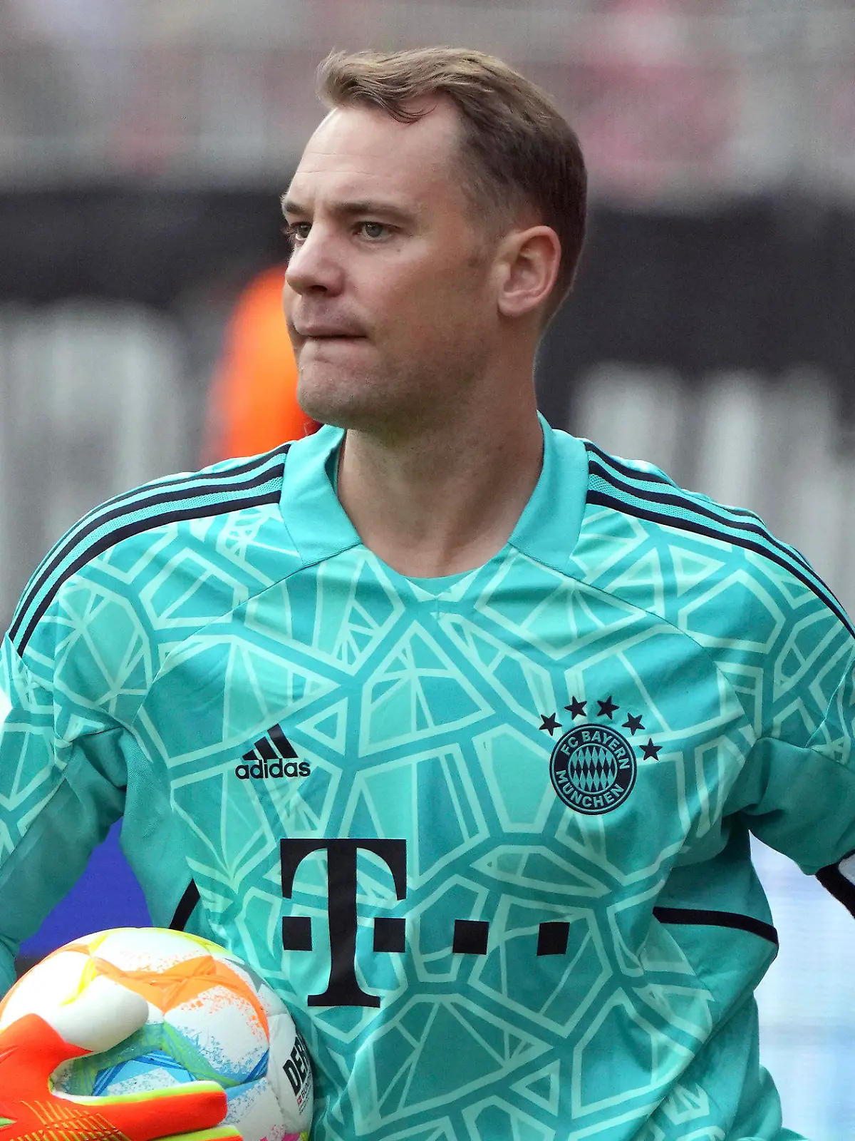 FILE -- Bayern's goalkeeper Manuel Neuer holds the ball during the German Bundesliga soccer match between 1. FC Union Berlin and FC Bayern Munich in Berlin, Germany, Saturday, Sept. 3, 2022. Bayern Munich and Germany goalkeeper Manuel Neuer says he was previously treated for skin cancer and had to undergo surgery. Neuer says he has a scar near his nose and that he was “operated on three times.”  (AP Photo/Michael Sohn, file)