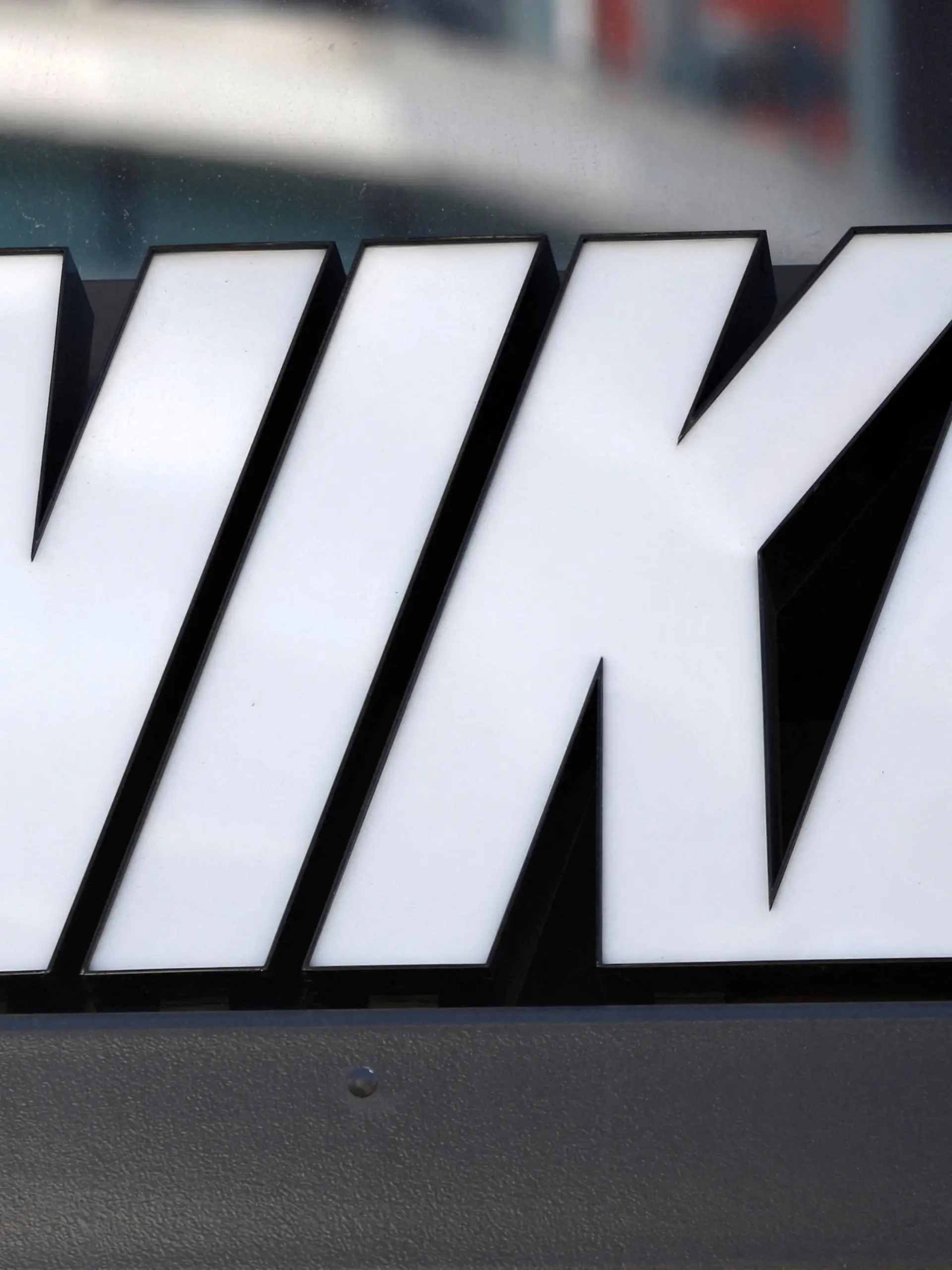 FILE PHOTO: The logo of Dow Jones Industrial Average stock market index listed company Nike (NKE) is seen in Los Angeles, California, United States, April 12, 2016. REUTERS/Lucy Nicholson/File Photo