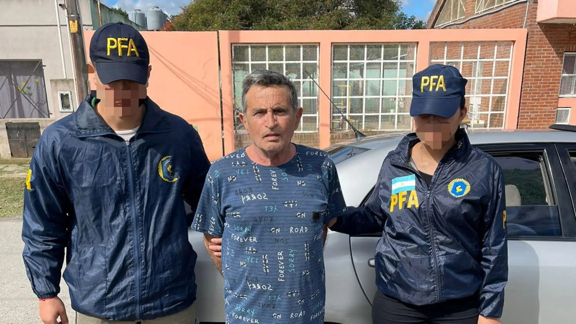 Police escort Carmine Alfonso Maiorano after he was detained in Guernica, Argentina, in this undated handout image provided by Argentina's Federal Police October 31, 2022. Policia Federal Argentina/Handout via REUTERS ATTENTION EDITORS - THIS IMAGE HAS BEEN SUPPLIED BY A THIRD PARTY. NO RESALES. NO ARCHIVES. THE IMAGE HAS BEEN BLURRED AT SOURCE.