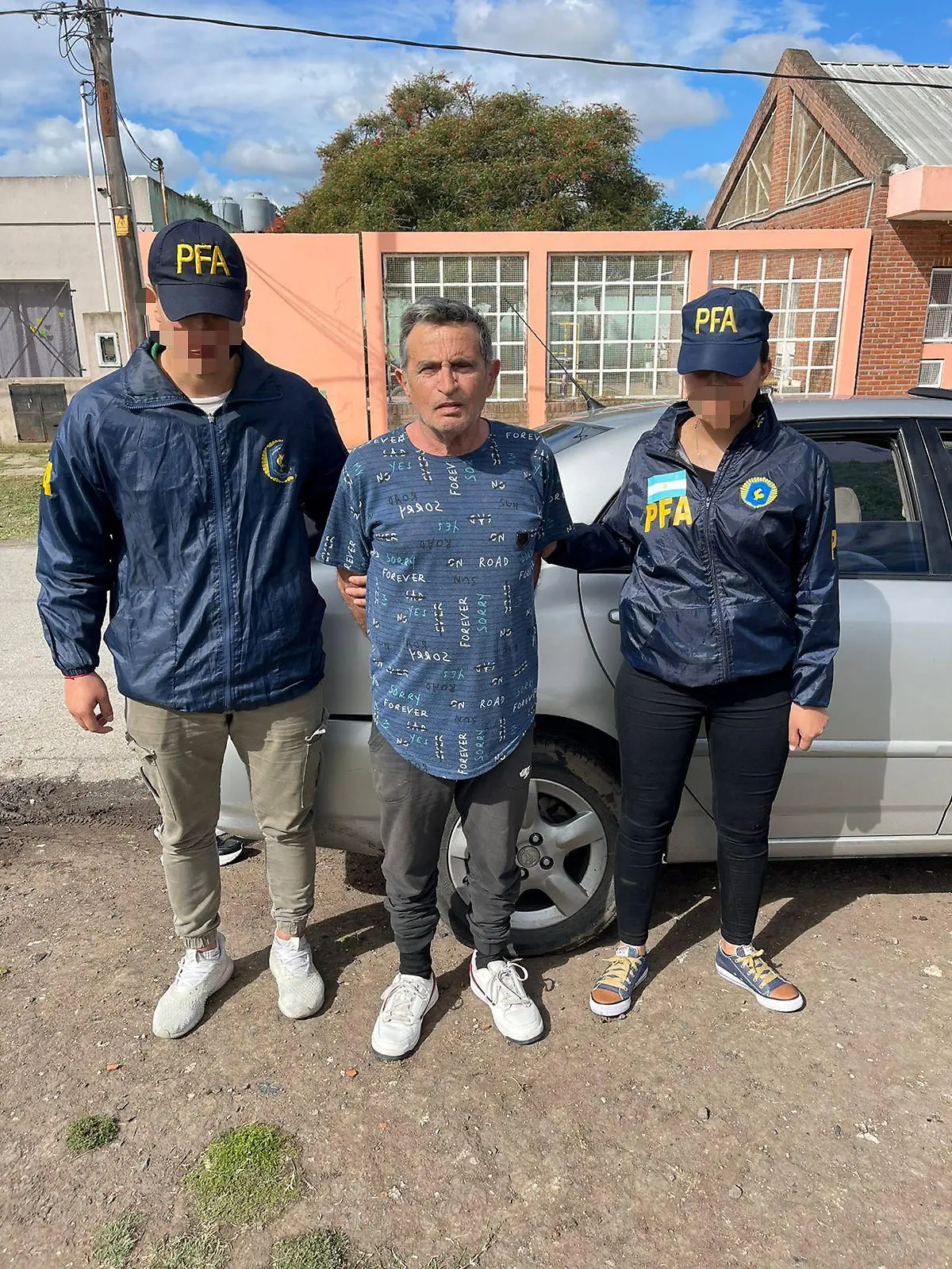 Police escort Carmine Alfonso Maiorano after he was detained in Guernica, Argentina, in this undated handout image provided by Argentina's Federal Police October 31, 2022.  Policia Federal Argentina/Handout via REUTERS ATTENTION EDITORS - THIS IMAGE HAS BEEN SUPPLIED BY A THIRD PARTY. NO RESALES. NO ARCHIVES. THE IMAGE HAS BEEN BLURRED AT SOURCE.