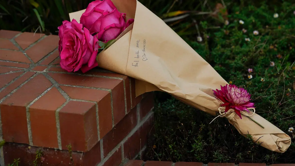 Flowers can be seen outside the home of House Speaker Nancy Pelosi and her husband Paul Pelosi in San Francisco, Friday, Oct. 28, 2022. Paul Pelosi, was attacked and severely beaten by an assailant with a hammer who broke into their San Francisco home early Friday, according to people familiar with the investigation. (AP Photo/Godofredo A. Vásquez)