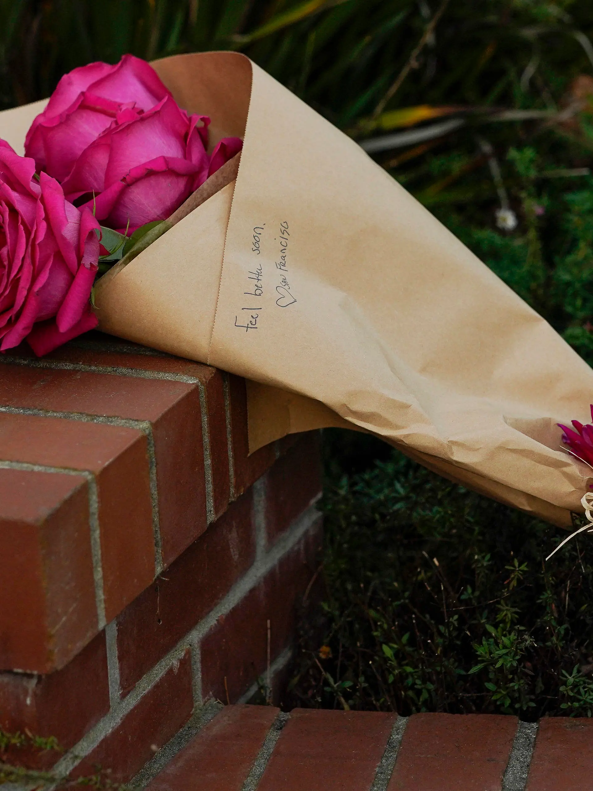 Flowers can be seen outside the home of House Speaker Nancy Pelosi and her husband Paul Pelosi in San Francisco, Friday, Oct. 28, 2022. Paul Pelosi, was attacked and severely beaten by an assailant with a hammer who broke into their San Francisco home early Friday, according to people familiar with the investigation. (AP Photo/Godofredo A. Vásquez)