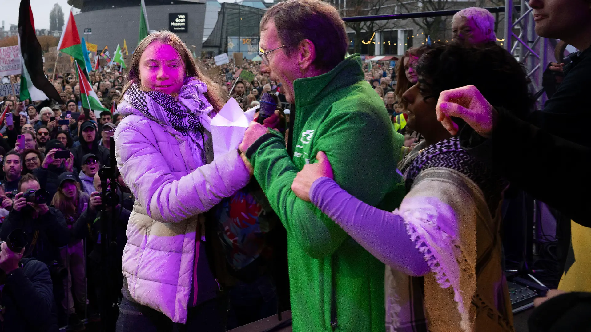 Climate activist Greta Thunberg is interrupted by a climate activist after Thunberg expressed solidarity with the Palestinians as tens of thousands of people marched through Amsterdam, Netherlands, Sunday, Nov. 12, 2023, to call for more action to tackle climate change. Thunberg was among the speakers at the march that comes 10 days before national elections in the Netherlands. (AP Photo/Peter Dejong)