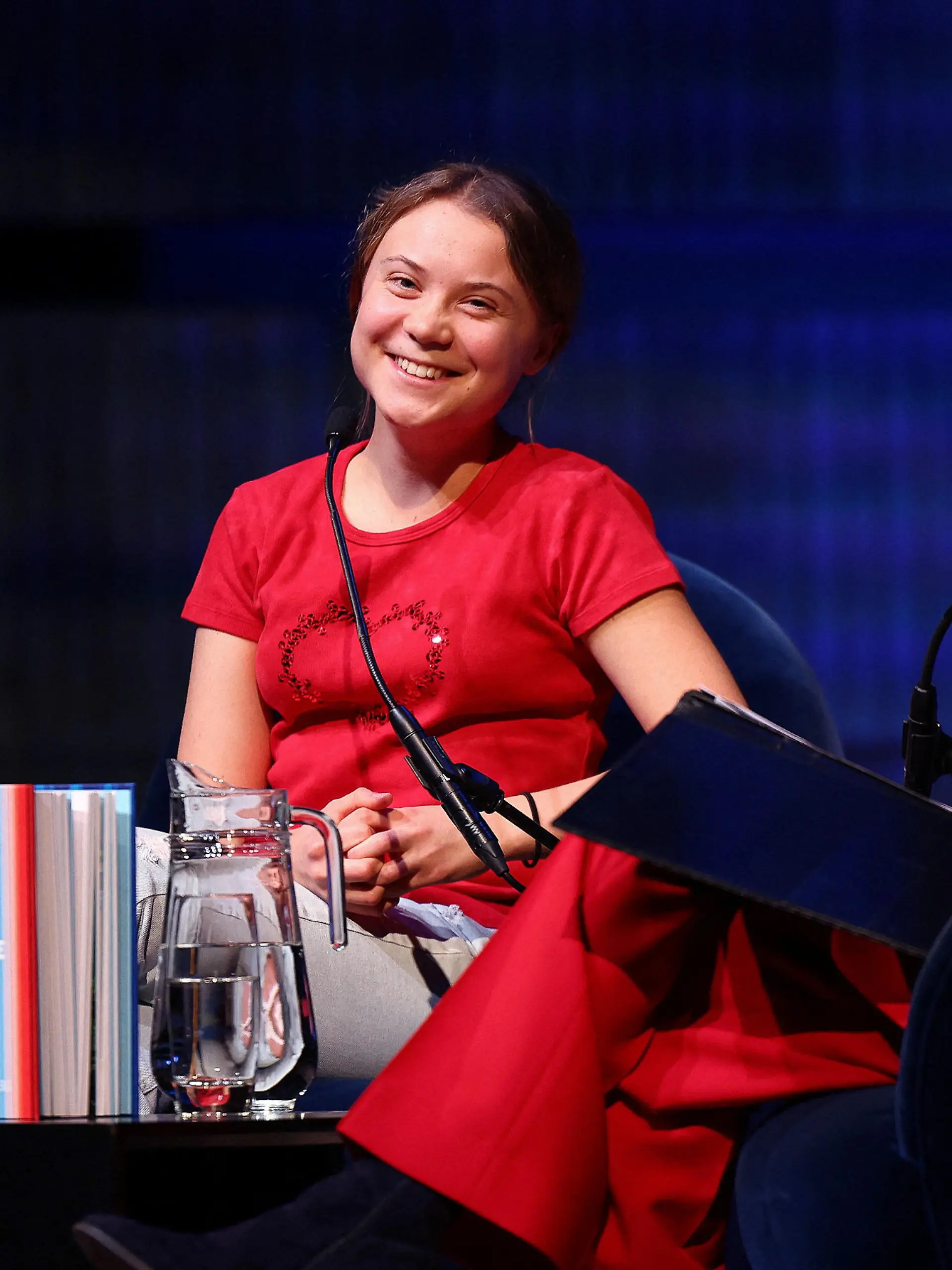Swedish climate activist Greta Thunberg speaks with British journalist Samira Ahmed (not pictured) on stage at the Royal Festival Hall during the launch event of her new book "The Climate Book", during The Southbank Centre’s London Literature Festival, in London, Britain, October 30, 2022. REUTERS/Henry Nicholls