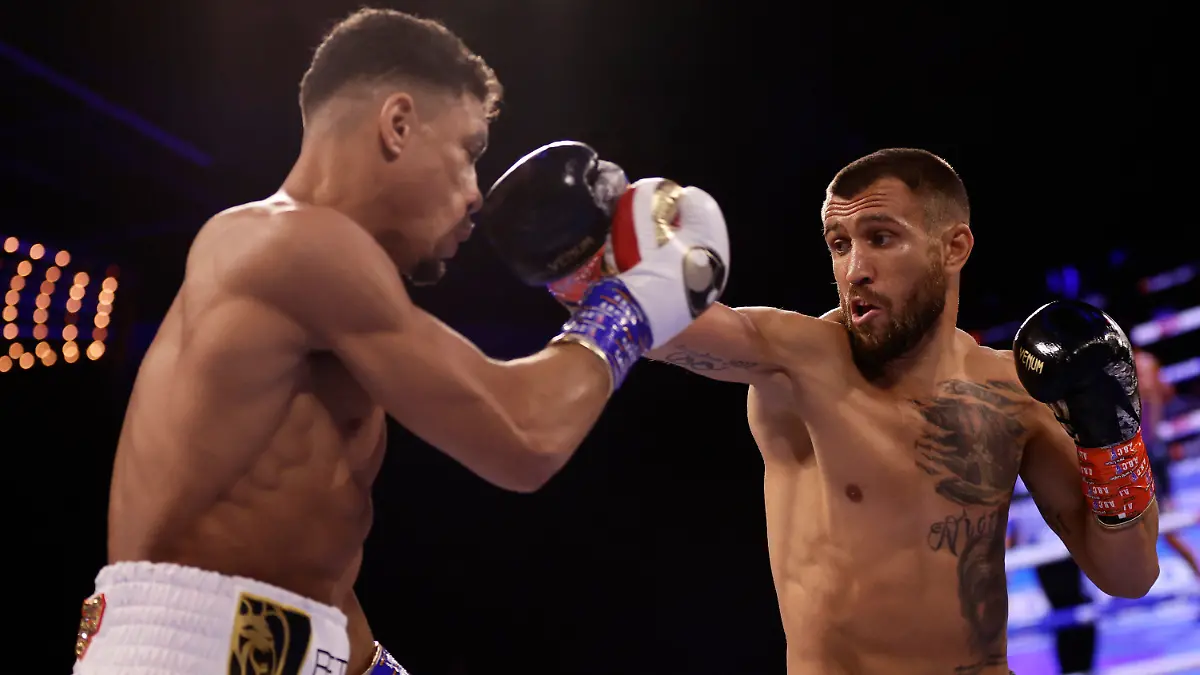 Vasiliy Lomachenko, right, punches Jamaine Ortiz during a lightweight boxing match Saturday, Oct. 29, 2022, in New York. (AP Photo/Adam Hunger)
