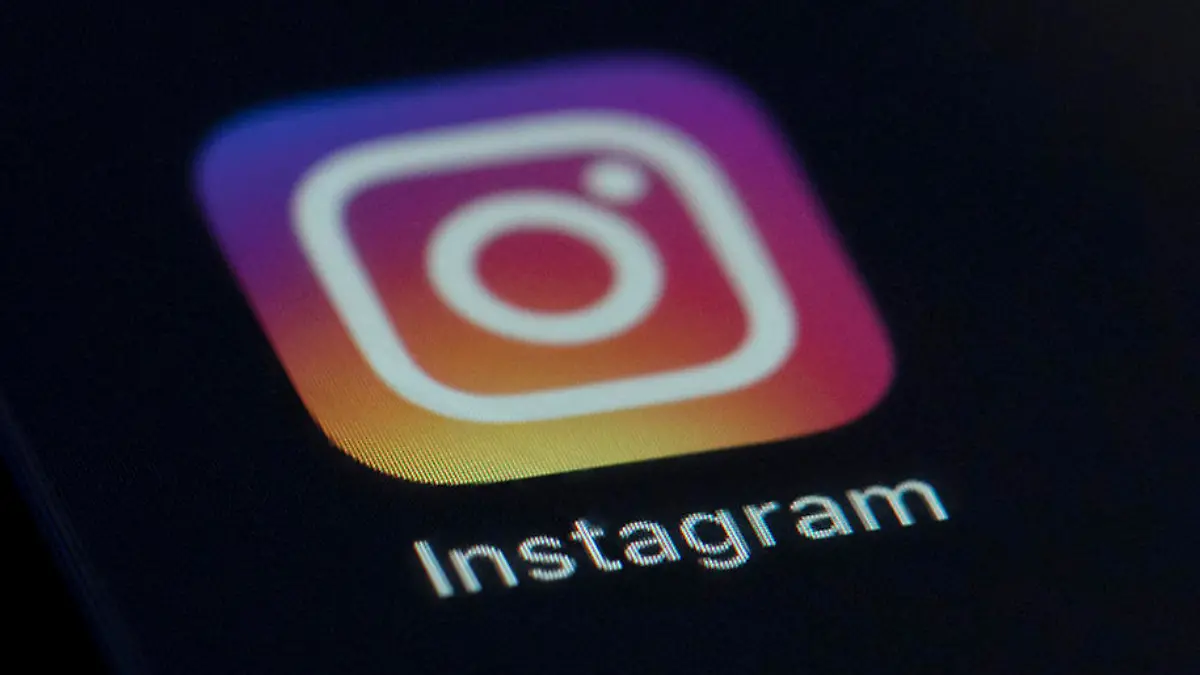 FILE - This Friday, Aug. 23, 2019 photo shows the Instagram app icon on the screen of a mobile device in New York. Irish privacy regulators have opened two investigations into Instagram over the social media site's handling of children's data. Ireland's Data Protection Commission said on Sunday, Oct. 18, 2020 it launched the investigations in September after receiving complaints about the company. Facebook, which owns Instagram, said it's in “close contact” with the commission and is "cooperating with their inquiries.” (AP Photo/Jenny Kane, file)