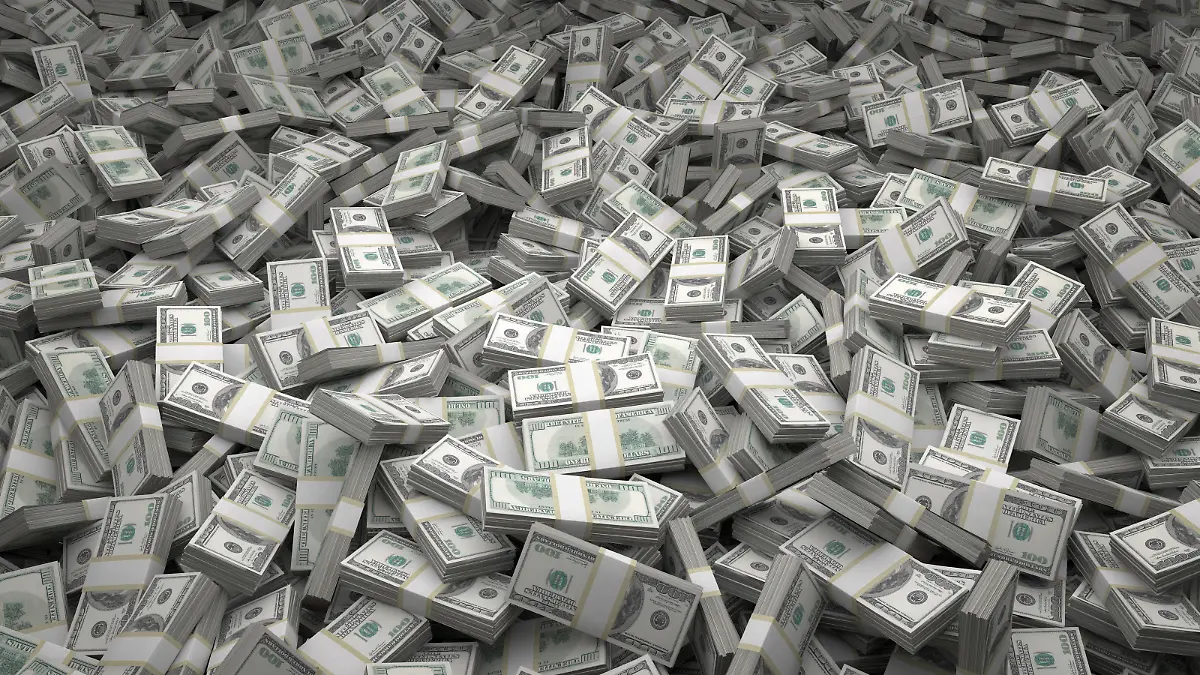 Bundles of $100 US dollar bills scattered randomly. Billions of dollars worth of money spread over the ground and viewed from above. A sea of money and great background.