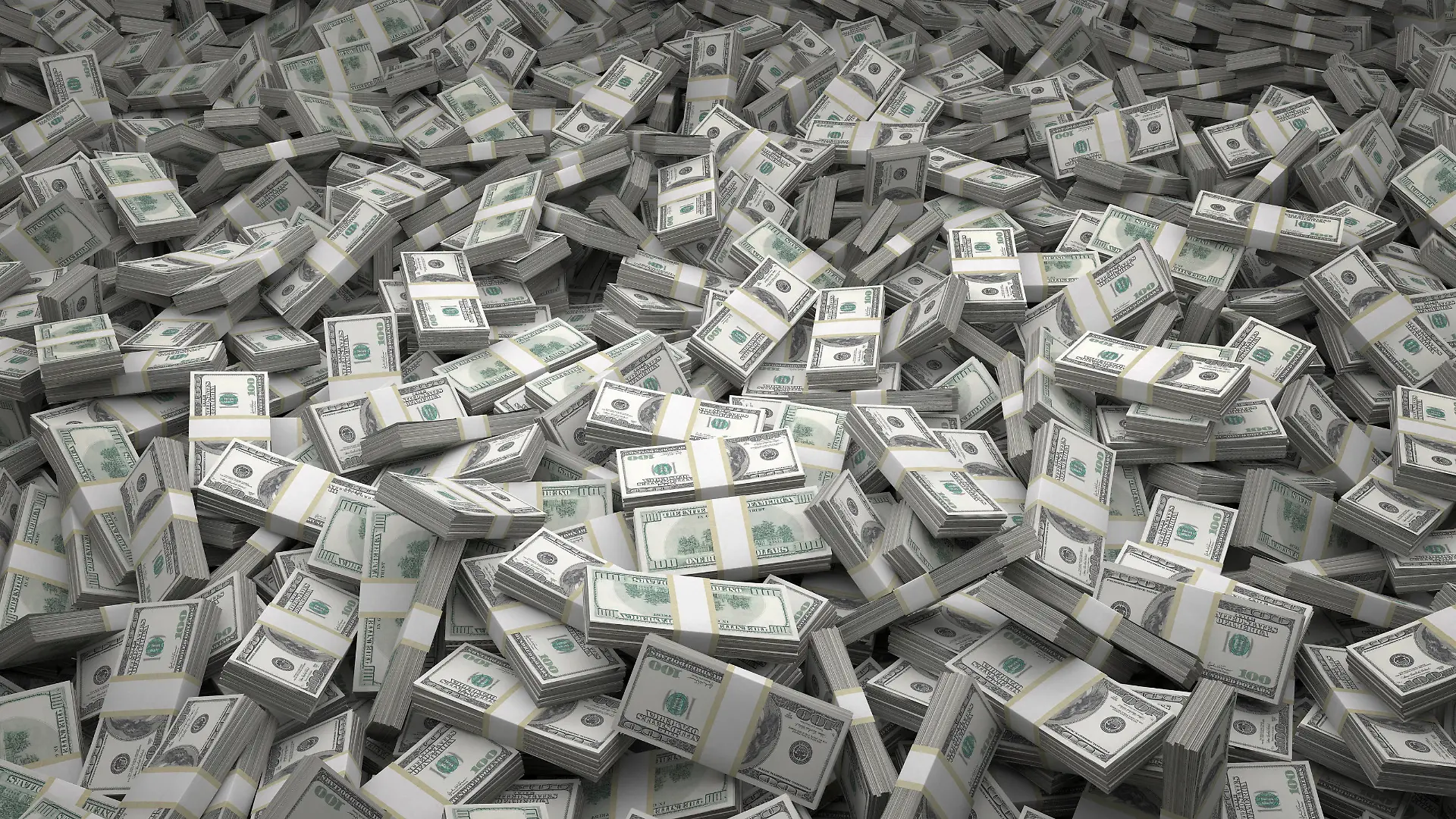 Bundles of $100 US dollar bills scattered randomly. Billions of dollars worth of money spread over the ground and viewed from above. A sea of money and great background.