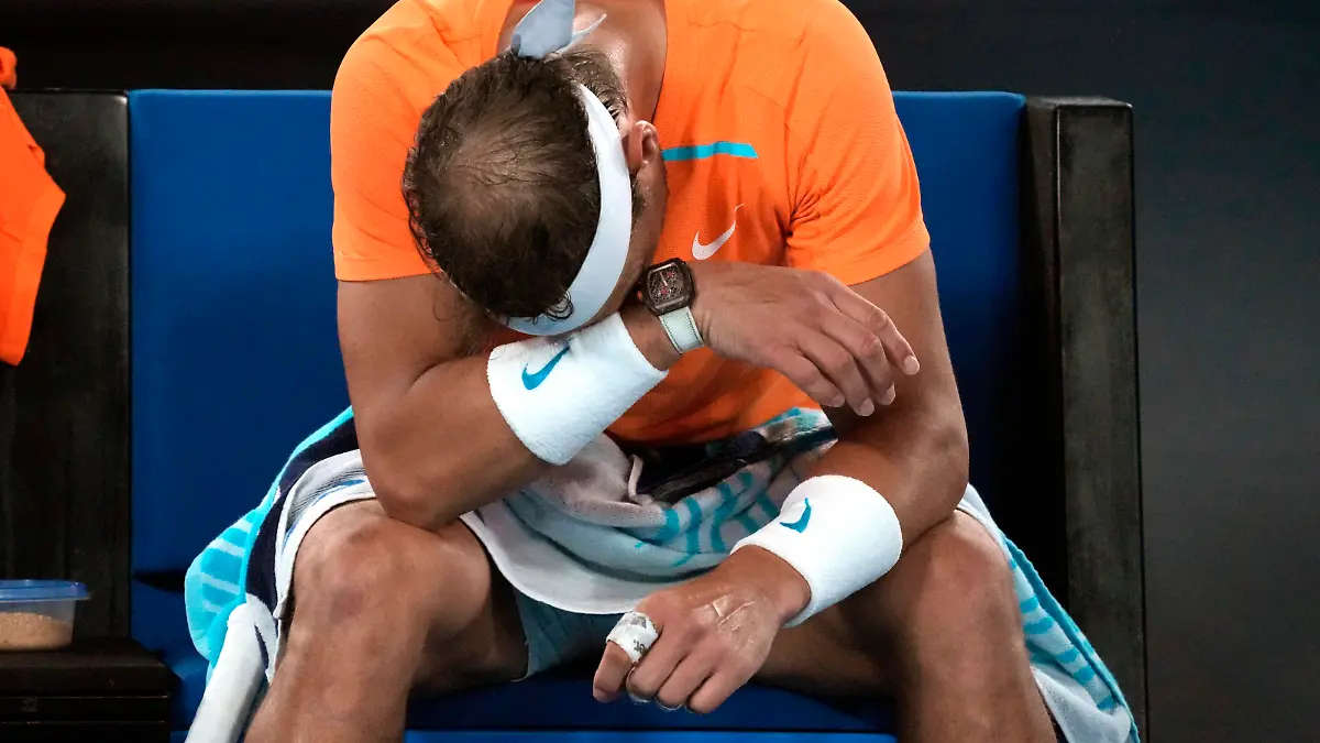 Rafael Nadal of Spain reacts during his second round loss to Mackenzie McDonald of the U.S. at the Australian Open tennis championship in Melbourne, Australia, Wednesday, Jan. 18, 2023. (AP Photo/Dita Alangkara)