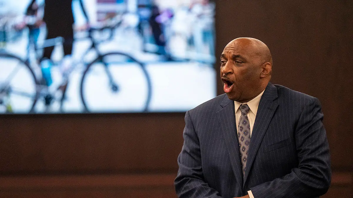 State attorney Rickey Jones mimics giving chest compressions as he describes the murder of Anna Moriah Wilson while giving closing arguments during Kaitlin Armstrong's murder trial at the Blackwell-Thurman Criminal Justice Center on Thursday, Nov. 16, 2023, Austin, Texas. Armstrong is charged with killing of Anna Moriah Wilson in May 2022. (Mikala Compton/Austin American-Statesman via AP, Pool)