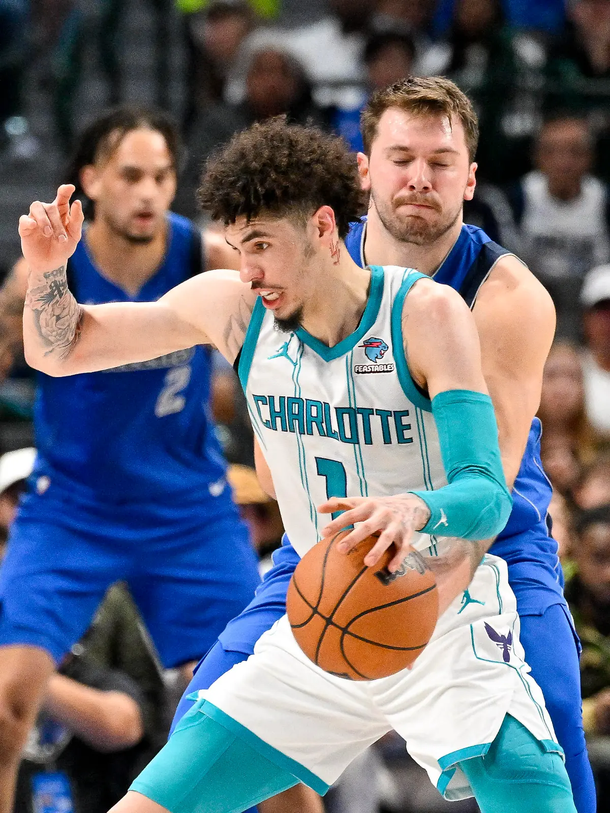 Nov 5, 2023; Dallas, Texas, USA; Dallas Mavericks guard Luka Doncic (77) attempts to knock the ball away from Charlotte Hornets guard LaMelo Ball (1) during the second quarter at the American Airlines Center. Mandatory Credit: Jerome Miron-USA TODAY Sports