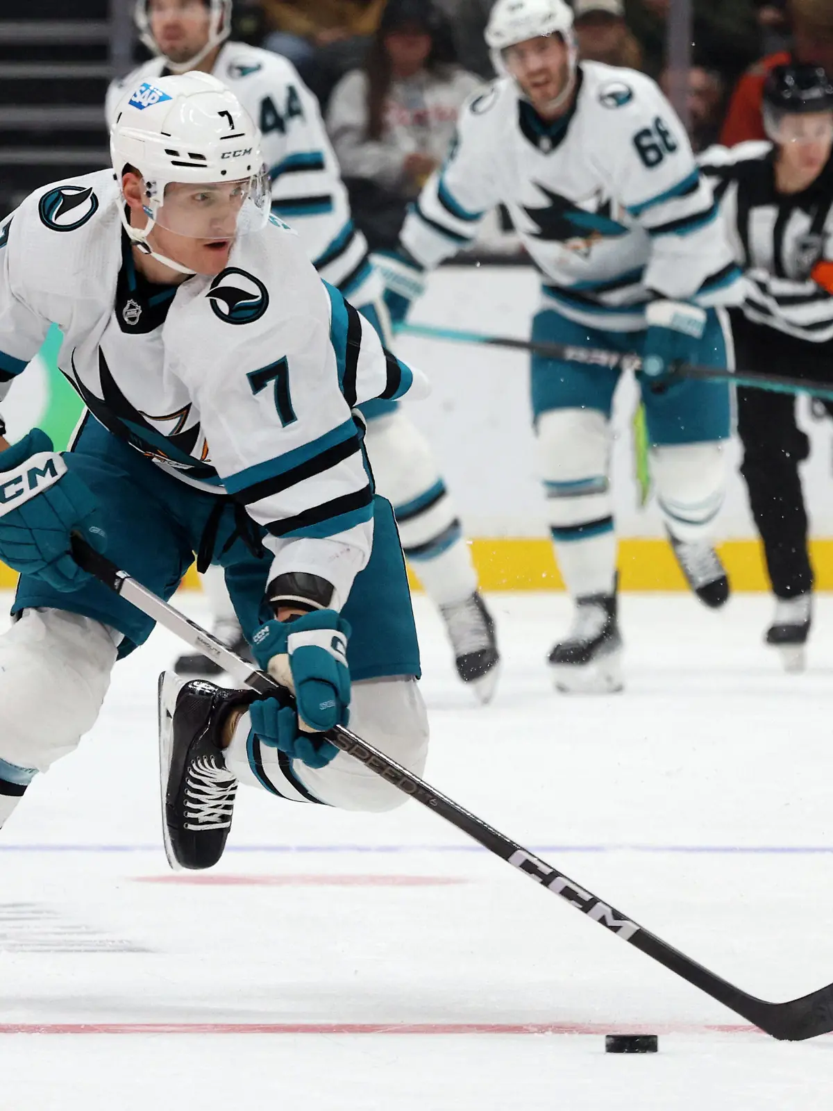Nov 12, 2023; Anaheim, California, USA; San Jose Sharks center Nico Sturm (7) skates with the puck during the first period against the Anaheim Ducksa at Honda Center. Mandatory Credit: Jason Parkhurst-USA TODAY Sports