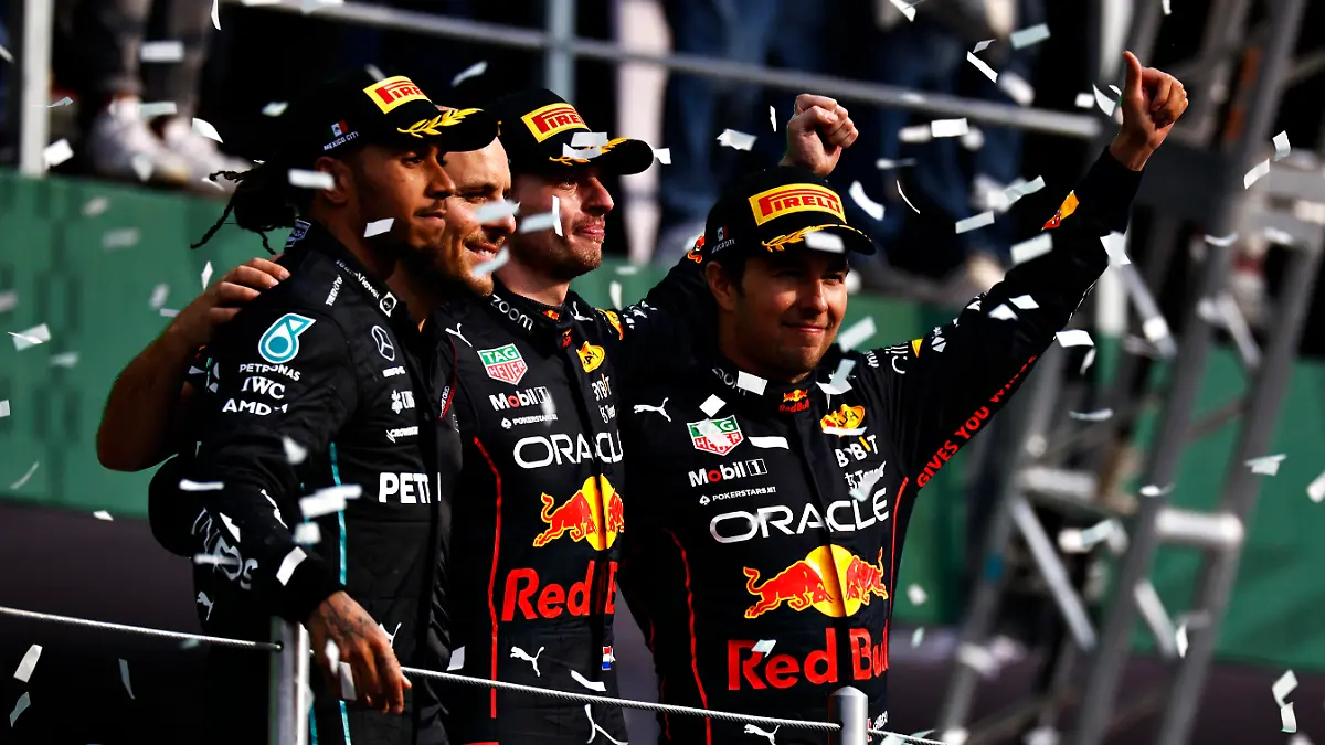 MEXICO CITY, MEXICO - OCTOBER 30: Race winner Max Verstappen of the Netherlands and Oracle Red Bull Racing, Second placed Lewis Hamilton of Great Britain and Mercedes, Third placed Sergio Perez of Mexico and Oracle Red Bull Racing and Red Bull Racing race engineer Gianpiero Lambiase celebrate on the podium during the F1 Grand Prix of Mexico at Autodromo Hermanos Rodriguez on October 30, 2022 in Mexico City, Mexico. (Photo by Chris Graythen/Getty Images)