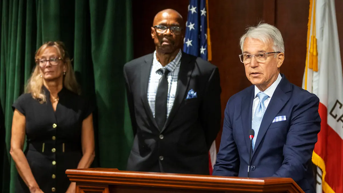 In this photo provided by Cal State LA, Maurice Hastings, center, appears at a news conference with Los Angeles County District Attorney George Gascon, right, to announce he was released after 38 years in prison due to a erroneous conviction, Friday, Oct. 28, 2022, in Los Angeles. (J. Emilio Flores/Cal State LA via AP)
