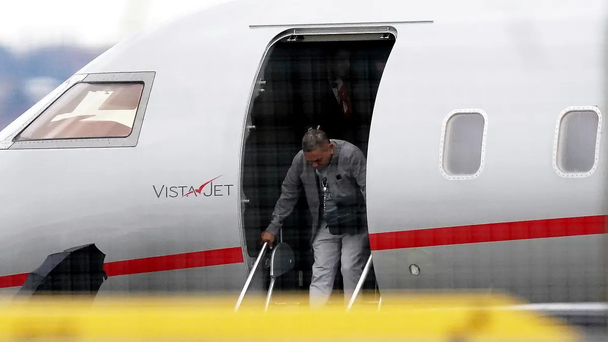 Luis Manuel Diaz, father of Liverpool player Luis Diaz disembarks a plan at John Lennon Airport, in Liverpool, England, Saturday, Nov. 18, 2023. Liverpool have flown Luis Diaz's parents to Merseyside so they can spend Christmas with their son after their recent kidnapping ordeal.  Luis Manuel Diaz was held captive for 12 days in a mountainous region by the ELN guerrilla group. He was reunited with his family on Tuesday. (Martin Rickett/PA via AP)