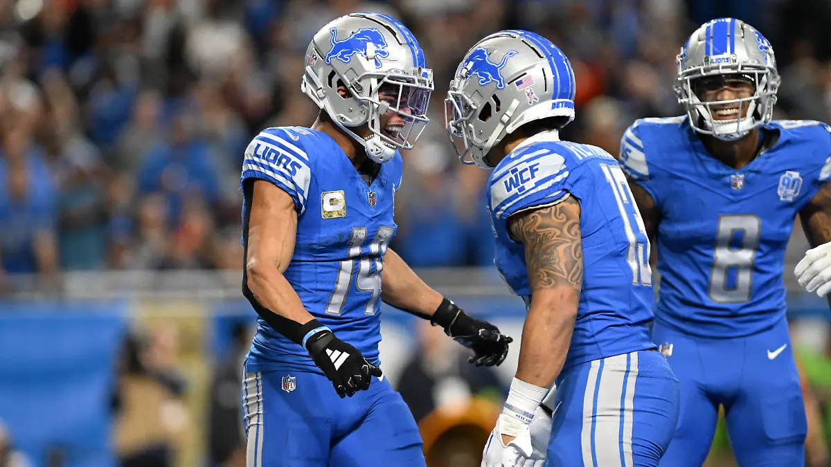 Nov 19, 2023; Detroit, Michigan, USA; Detroit Lions wide receiver Amon-Ra St. Brown (14) celebrates with teammates after scoring a touchdown against the Chicago Bears in the second quarter at Ford Field. Mandatory Credit: Lon Horwedel-USA TODAY Sports