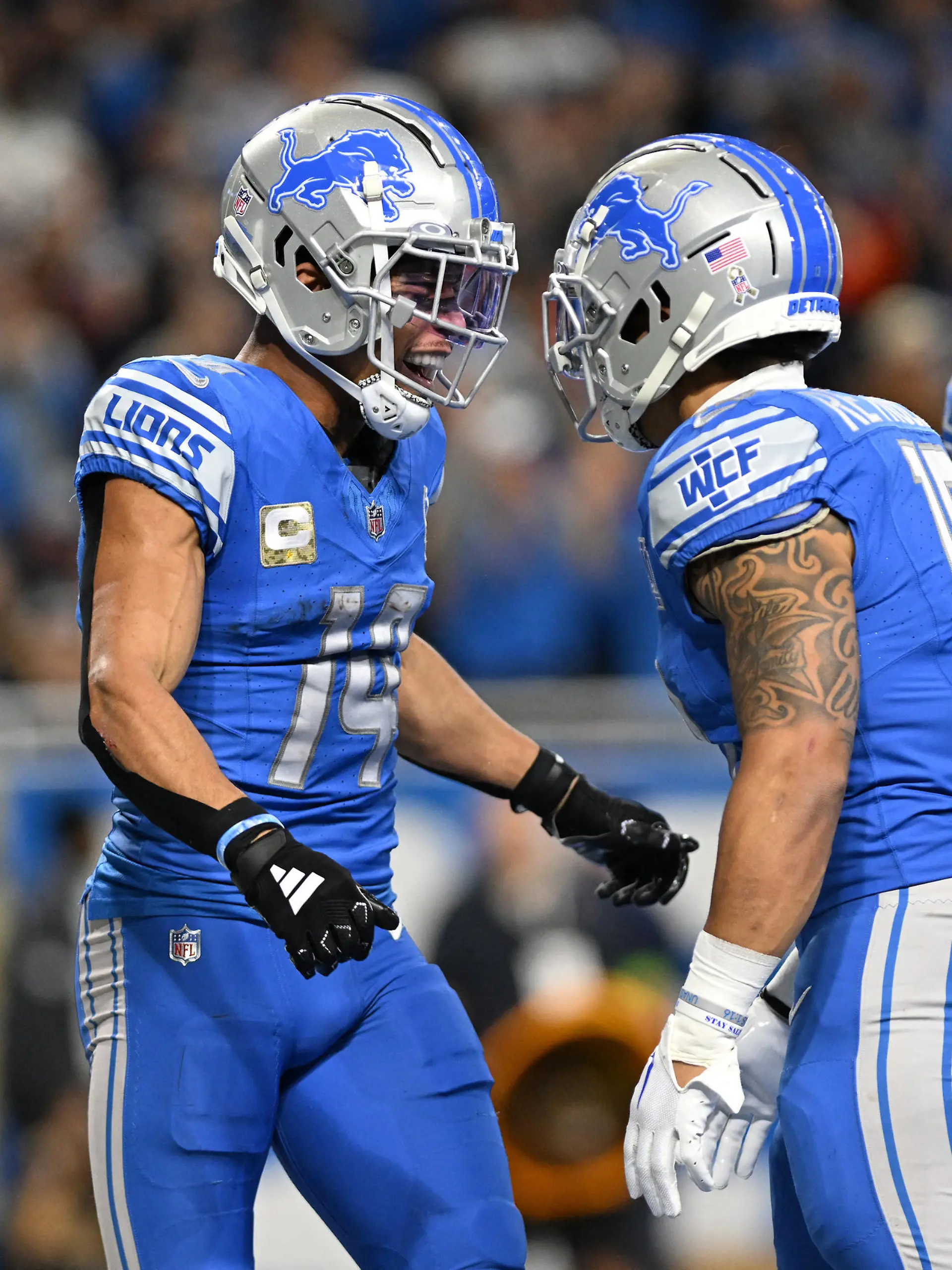 Nov 19, 2023; Detroit, Michigan, USA; Detroit Lions wide receiver Amon-Ra St. Brown (14) celebrates with teammates after scoring a touchdown against the Chicago Bears in the second quarter at Ford Field. Mandatory Credit: Lon Horwedel-USA TODAY Sports