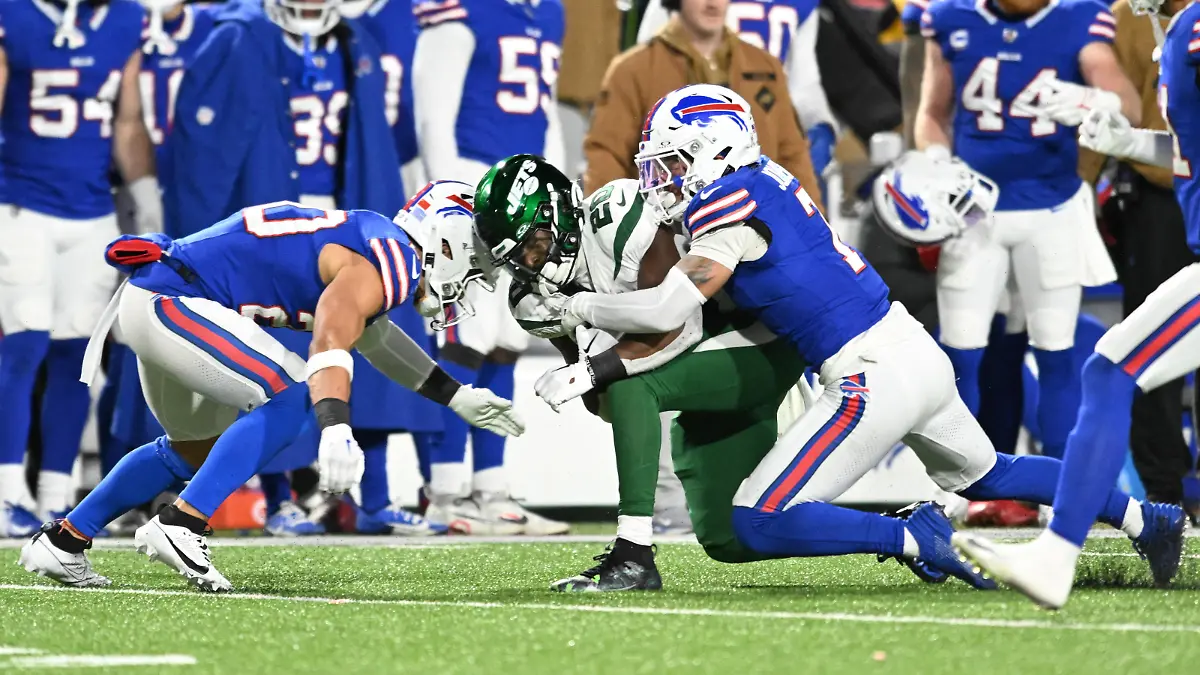 Nov 19, 2023; Orchard Park, New York, USA; Buffalo Bills safety Taylor Rapp (left) was injured on a tackle of New York Jets running back Breece Hall (20) requiring an ambulance in the second quarter. Also in the play is Buffalo Bills cornerback Taron Johnson (7) at Highmark Stadium. Mandatory Credit: Mark Konezny-USA TODAY Sports