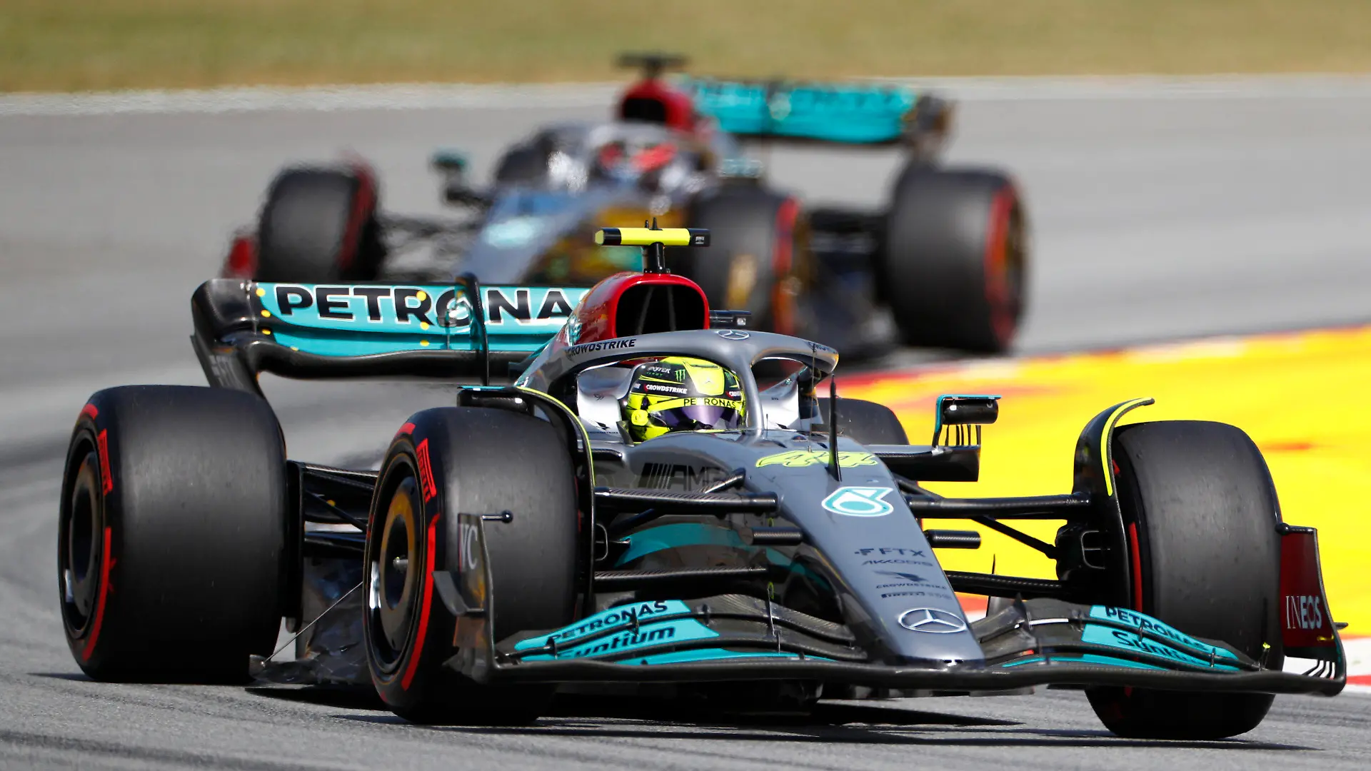 Mercedes driver Lewis Hamilton of Britain leads his teammate George Russell of Britain during the qualifying session at the Barcelona Catalunya racetrack in Montmelo, Spain, Saturday, May 21, 2022. The Formula One race will be held on Sunday. (AP Photo/Joan Monfort)