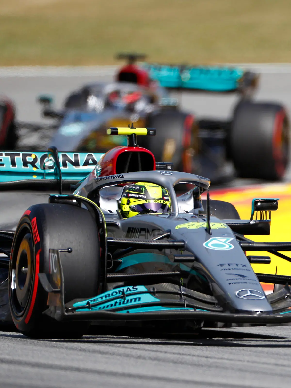 Mercedes driver Lewis Hamilton of Britain leads his teammate George Russell of Britain during the qualifying session at the Barcelona Catalunya racetrack in Montmelo, Spain, Saturday, May 21, 2022. The Formula One race will be held on Sunday. (AP Photo/Joan Monfort)