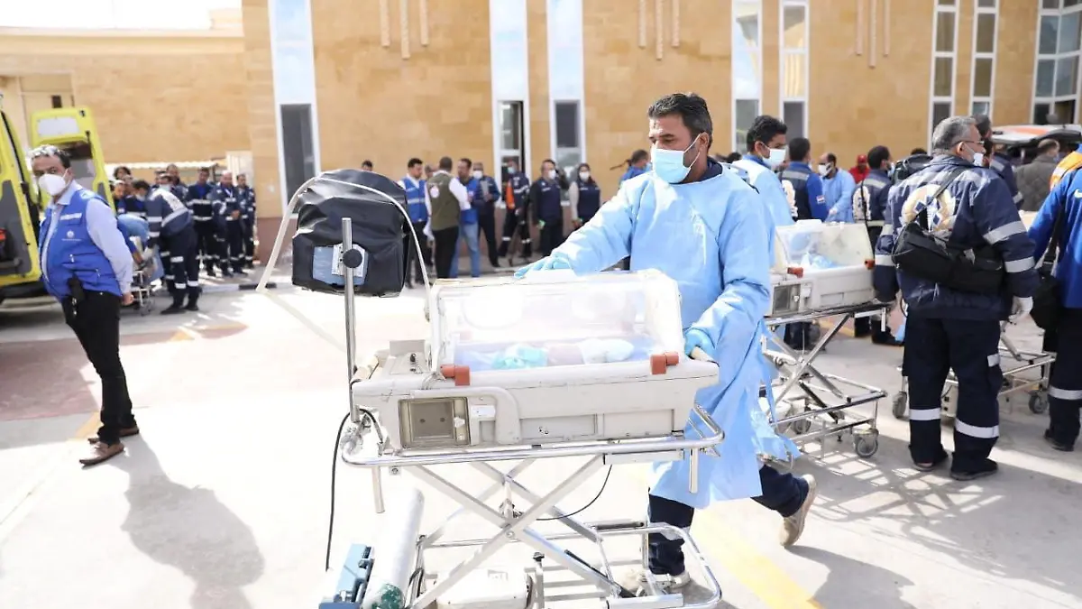 Medics transfer premature Palestinian babies evacuated from Gaza to ambulances on the Egyptian side of the Rafah border, amid the ongoing conflict between Israel and the Palestinian Islamist group Hamas, in Rafah, Egypt November 20, 2023 in this handout picture, courtesy of the Egyptian Health Ministry. The Egyptian Health Ministry/Handout via REUTERS ATTENTION EDITORS - THIS IMAGE WAS PROVIDED BY A THIRD PARTY