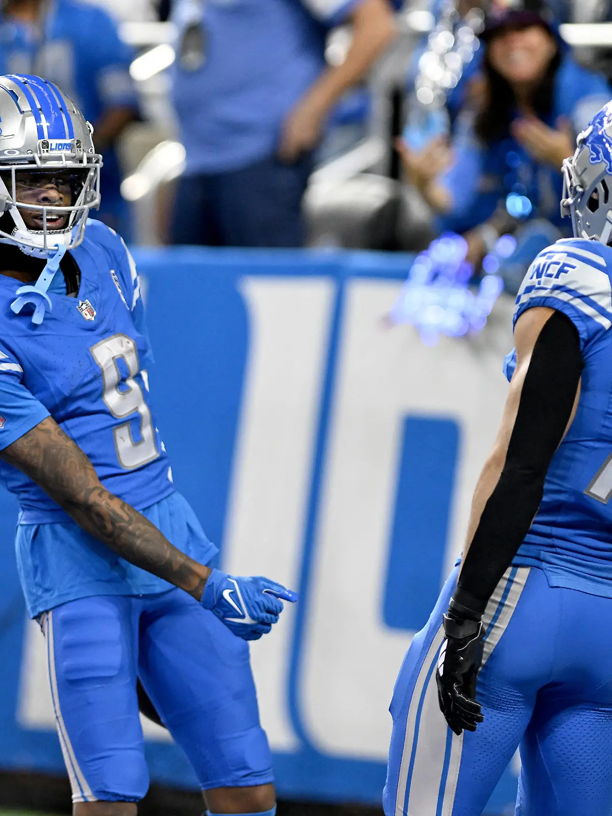 Nov 19, 2023; Detroit, Michigan, USA; Detroit Lions wide receiver Jameson Williams (9) celebrates with fellow wide receiver Amon-Ra St. Brown (14) after catching a touchdown pass against the Chicago Bears in the fourth quarter at Ford Field. Mandatory Credit: Lon Horwedel-USA TODAY Sports