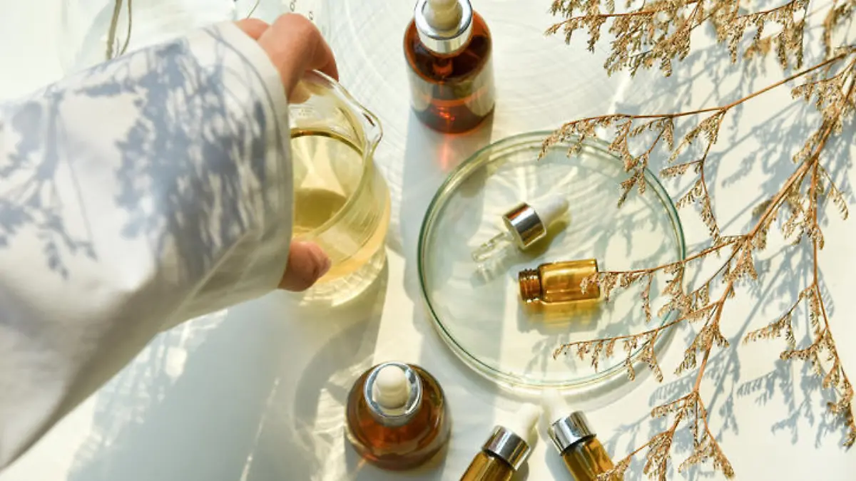 Scientist mixing natural skin care beauty products, Organic oil botany extraction and scientific laboratory glassware