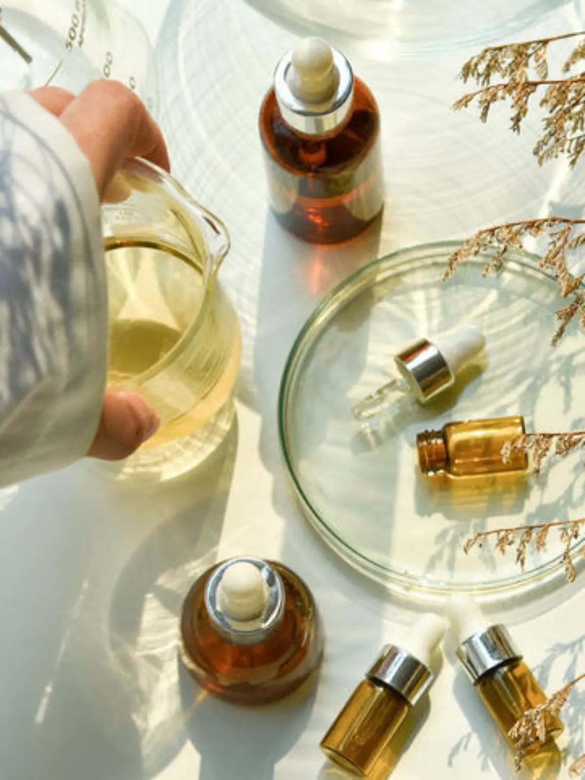 Scientist mixing natural skin care beauty products, Organic oil botany extraction and scientific laboratory glassware