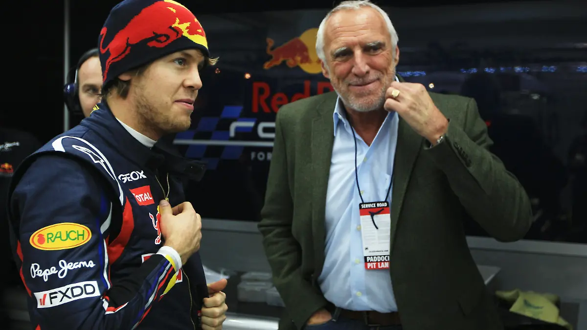 VALENCIA, SPAIN - FEBRUARY 02: Sebastian Vettel (L) of Germany and Red Bull Racing talks with Red Bull Racing team owner Dietrich Mateschitz (R) during day two of winter testing at the Ricardo Tormo Circuit on February 2, 2011 in Valencia, Spain. (Photo by Mark Thompson/Getty Images)