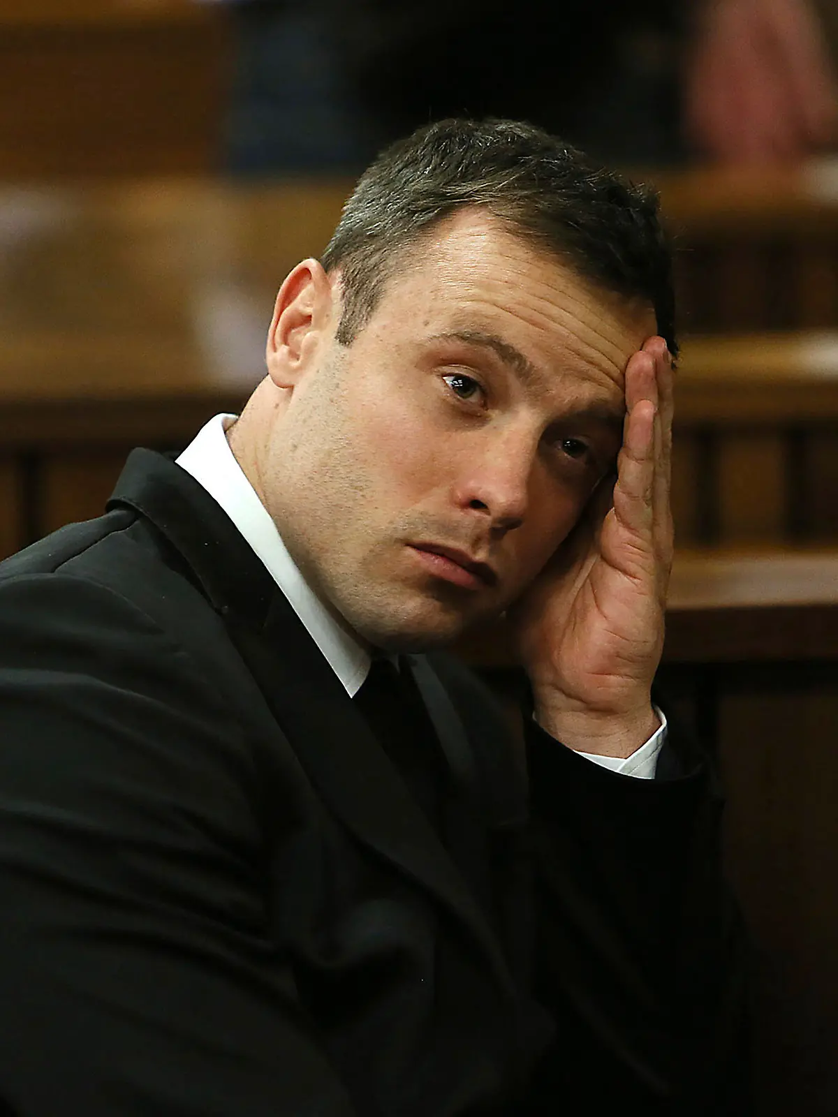 FILE - Oscar Pistorius gestures, at the end of the fourth day of sentencing proceedings in the high court in Pretoria, South Africa, Thursday, Oct. 16, 2014. Pistorius will have a second chance at parole at a hearing on Friday, Nov. 24, 2023 after he was wrongly ruled ineligible for early release from jail in March. South Africa’s department of corrections said in a statement on Monday, Nov. 20 that a parole board will consider the former Olympic runner’s case again this week. Pistorius turns 37 on Wednesday and has been in prison for nearly a decade. (Alon Skuy/Pool Photo via AP, File)
