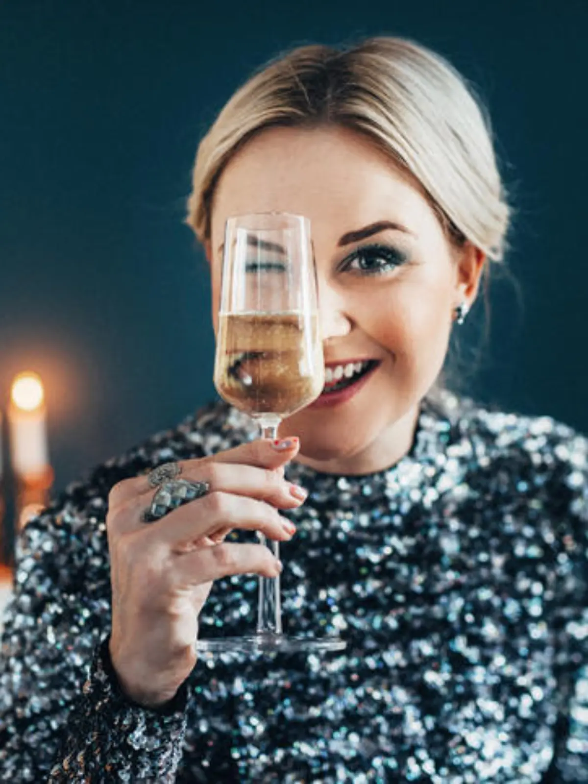 Beautiful woman celebrating new year with champagne
