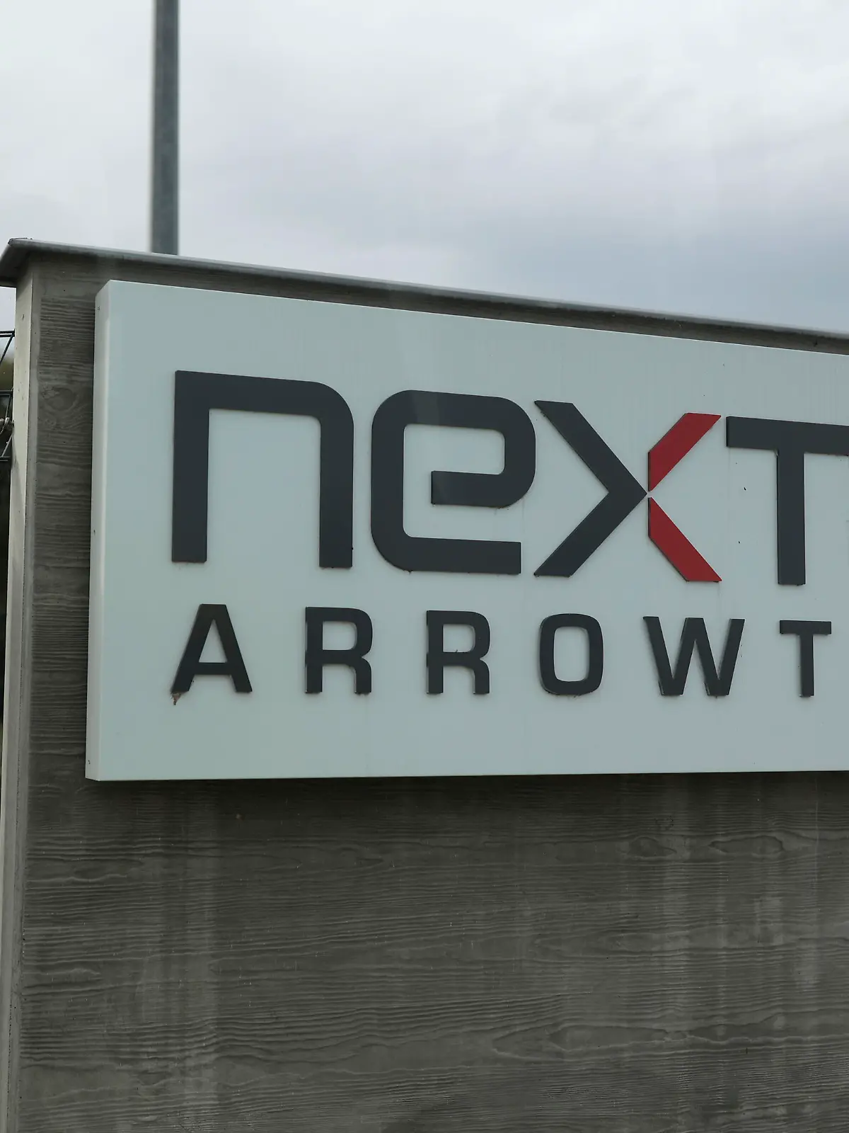 The entrance of the Nexter Arrowtech facility is pictured Thursday, Oct. 27, 2022 in Bourges, south of Paris. In a show of France's military prowess, President Emmanuel Macron has visited the Caesar cannon firing range and missile testing facility. The visit comes four months after Macron set out the need to adapt the French military to new conditions amid war in Europe. (AP Photo/Lewis Joly, Pool)