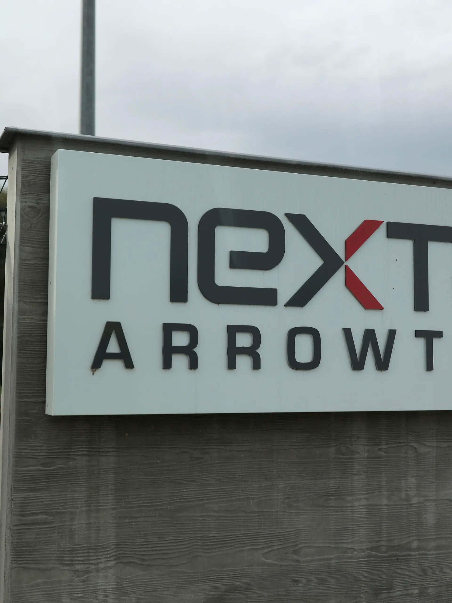 The entrance of the Nexter Arrowtech facility is pictured Thursday, Oct. 27, 2022 in Bourges, south of Paris. In a show of France's military prowess, President Emmanuel Macron has visited the Caesar cannon firing range and missile testing facility. The visit comes four months after Macron set out the need to adapt the French military to new conditions amid war in Europe. (AP Photo/Lewis Joly, Pool)