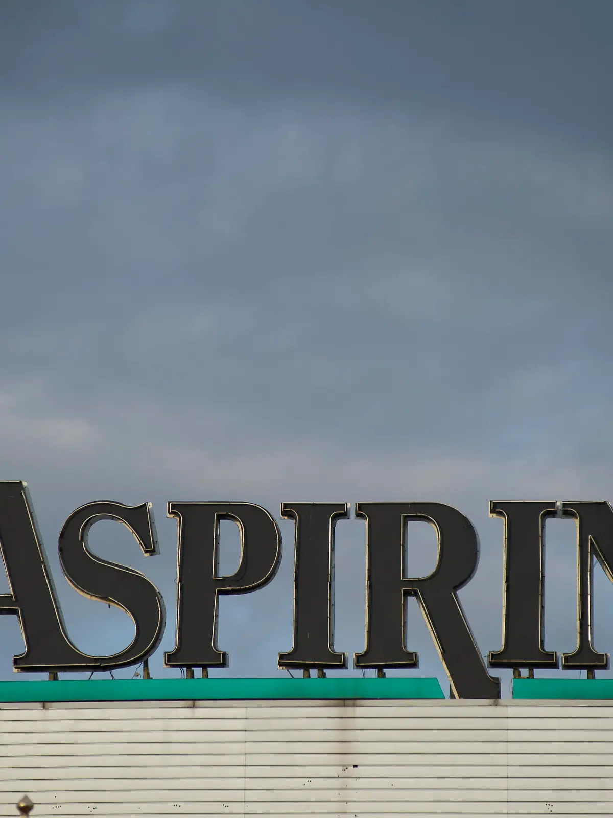 Aspirin logo is seen against rain clouds on October 7, 2020 in Warsaw, Poland. (Photo by Aleksander Kalka/NurPhoto)