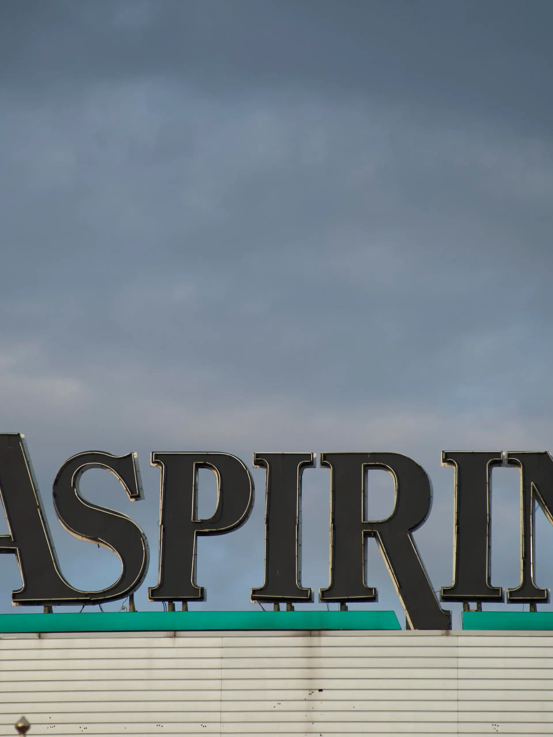Aspirin logo is seen against rain clouds on October 7, 2020 in Warsaw, Poland. (Photo by Aleksander Kalka/NurPhoto)