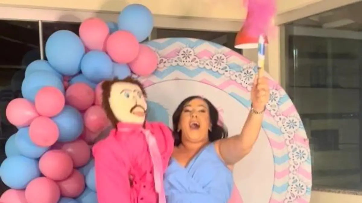 Story from Jam Press (Rag Doll Child) 

Pictured: Video grab of Meirivone and Marcelo revealing the gender of their second baby.

Woman who married rag doll hosts emotional gender reveal for their second rag doll child with 40 guests

A woman who hit the headlines after ‘marrying’ a rag doll has hosted a gender reveal party for their second rag doll child.

Meirivone Rocha Moraes has gone viral many times over the past few years, after sharing her whirlwind romance with the inanimate object –which her mum made for her.

The 37-year-old is now thrilled to announce she and her ‘husband’ Marcelo are expecting their second baby.

Taking to TikTok, she revealed the happy news in a clip that has over 279,200 views.In the video, the couple, who already have a son named Marcelinho, hold a smoke bomb that turns pink to reveal the budding baby is a girl – to be named Marcela.

“I wanted it to be a boy because I’ve heard having a girl is very expensive and much more work,” Meirivone told NeedToKnow.co.uk.

“But the baby will still be welcomed and very loved by me and her dad.

“Marcelo is very, very happy because he wanted a girl.

“He already has Marcelinho, who is our boy, so now a girl has made him very satisfied.”

The couple hosted the gender reveal in their home, surrounded by family and friends.

Meirivone added: “The party was good.

“There was chicken, pasta, salad and cake.

“We even had personalised sweets with our initials, music, soft drinks, and lots of guests, the event was attended by around 40 people.

“And the moment of revelation was really cool, the baby’s name will be Marcela.”

In the clip shared on social media, Meirivone and Marcelo can be seen standing in front of a pink and blue balloon display as she holds up a smoke grenade.

The smoke comes out clear before flashing a beautiful shade of pink.

Meirivone then screams with joy and jumps up and down.

The camera then shows her family and friends clapping and cel