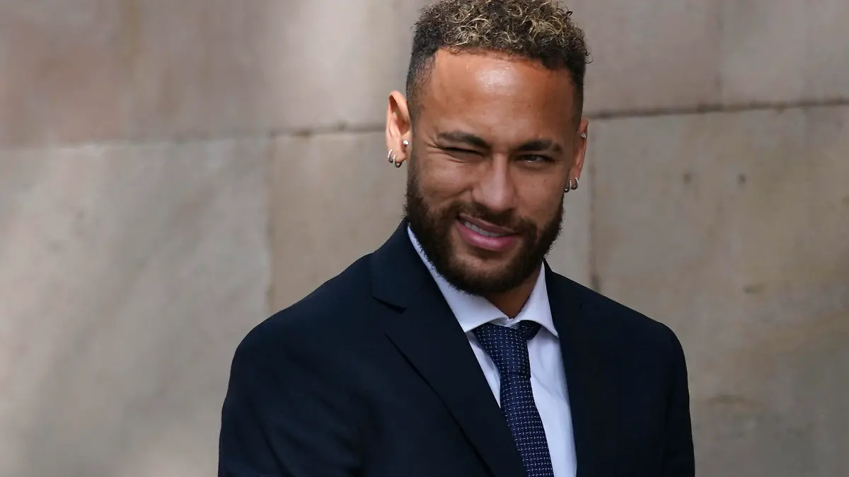 Former FC Barcelona player Neymar who now plays for Paris Saint-Germain winks as he leaves a court on the second day of a trial in Barcelona, Spain, Tuesday Oct. 18, 2022. Neymar appeared in court to face a trial over alleged irregularities involving his transfer to Barcelona in 2013. Neymar's parents, former Barcelona president Sandro Rosell and representatives for both the Spanish club and Brazilian team Santos are also in court after a complaint brought by Brazilian investment group DIS regarding the amount of the player's transfer. (AP Photo/Joan Mateu Parra)