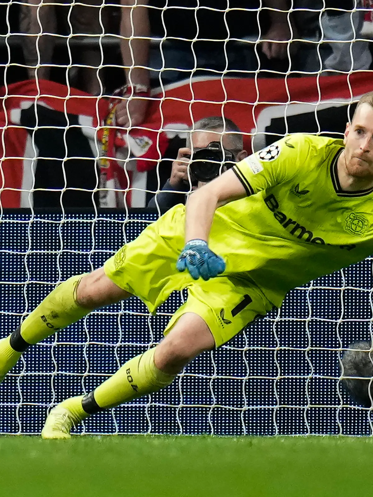 Leverkusen's goalkeeper Lukas Hradecky saves a penalty during the group B Champions League soccer match between Atletico Madrid and Bayer 04 Leverkusen at the Civitas Metropolitano stadium in Madrid, Spain, Wednesday, Oct. 26, 2022. (AP Photo/Manu Fernaandez)