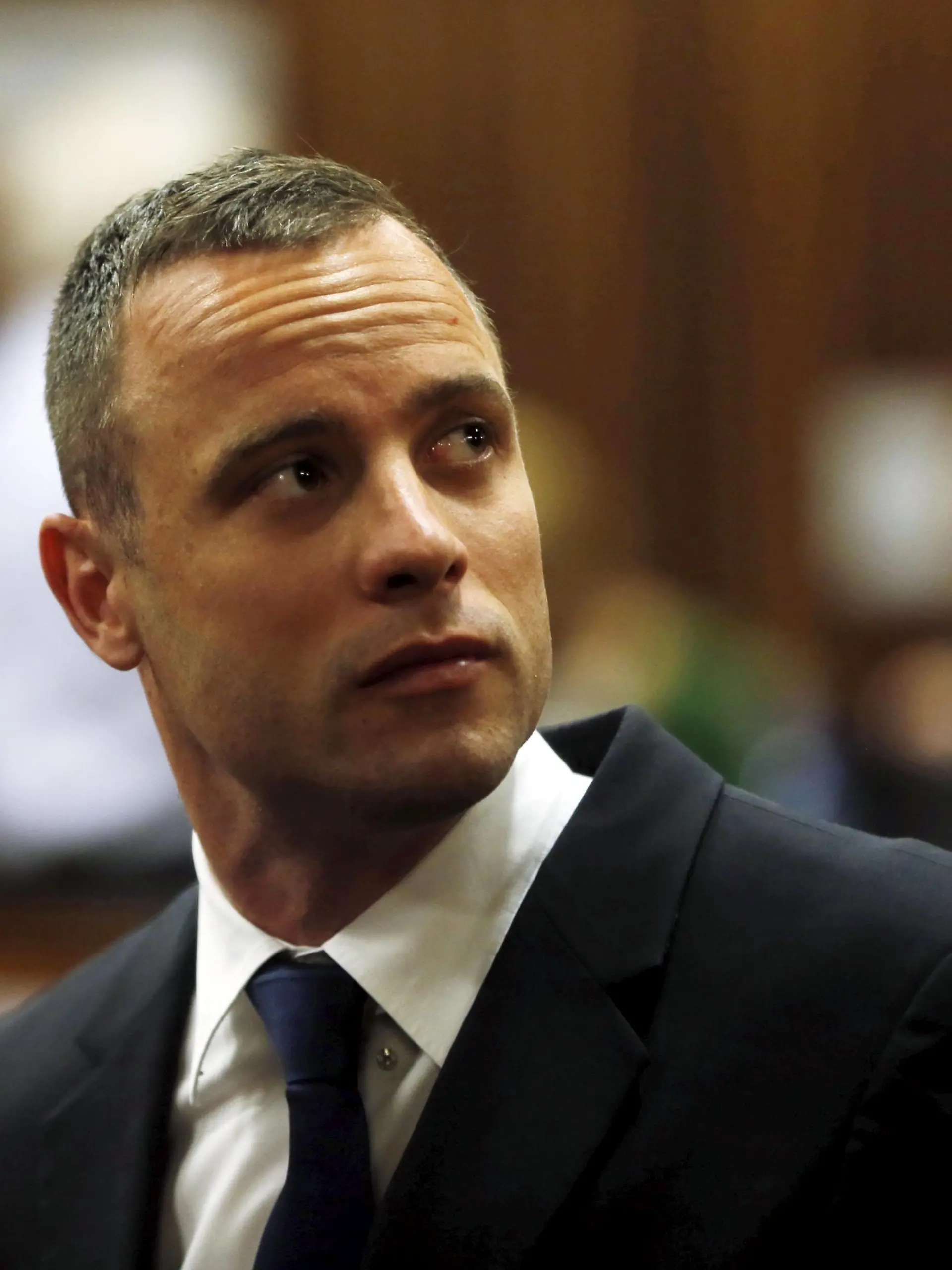 Olympic and Paralympic track star Oscar Pistorius sits in the dock in the North Gauteng High Court in Pretoria in this May 6, 2014 file photo. South Africa's top appeals court ruled on December 3, 2015 that Pistorius' conviction be scaled up to murder from culpable homicide for killing his girlfriend Reeva Steenkamp on Valentine's Day 2013. REUTERS/Mike Hutchings/Files TPX IMAGES OF THE DAY